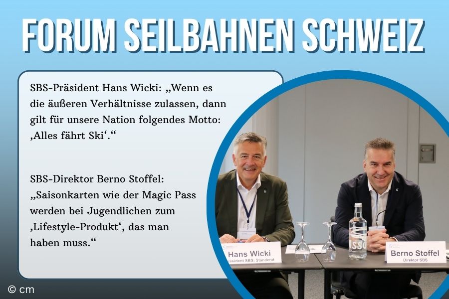 zwei Männer im Anzug sitzend